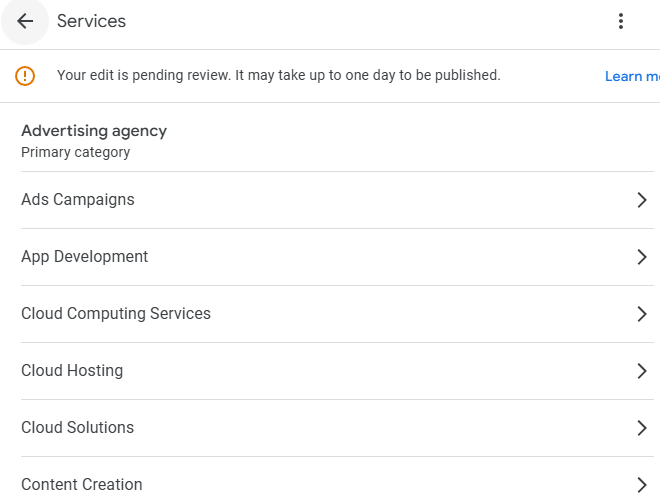 Google Business Profile services section showing an advertising agency category with listed services pending review.